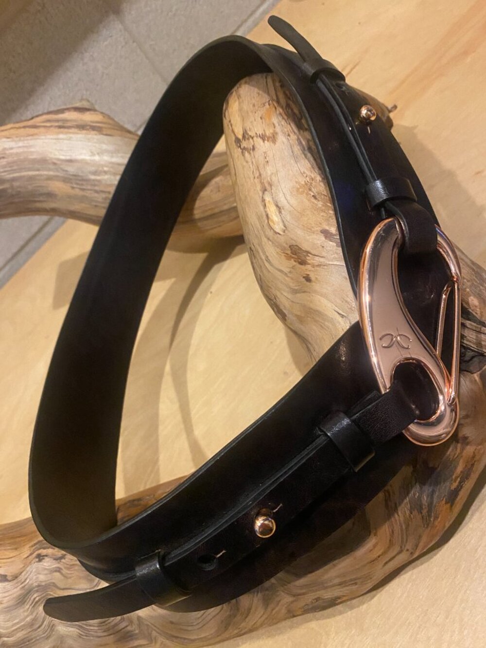 Striking Monika Chiang leather belt with rose gold colored carabiner-style clasp